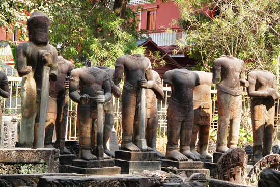 Headless statues suffering from looting.