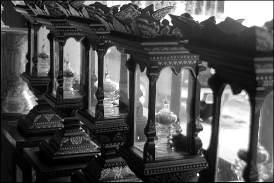 Wooden 'chedis' containing various coloured stones/ashes Wooden 'chedis' containing various coloured stones/ashes