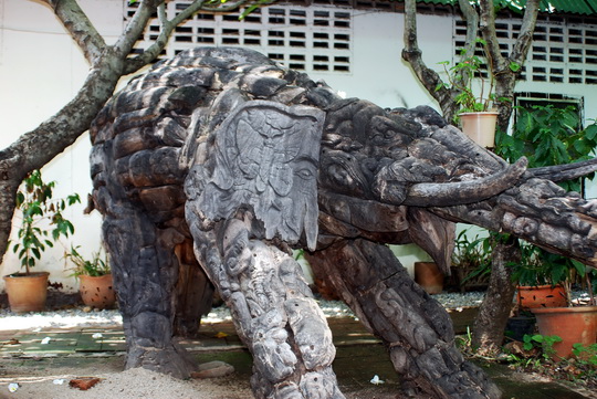 Odd, not very religious looking, wooden elephant Odd, not very religious looking, wooden elephant