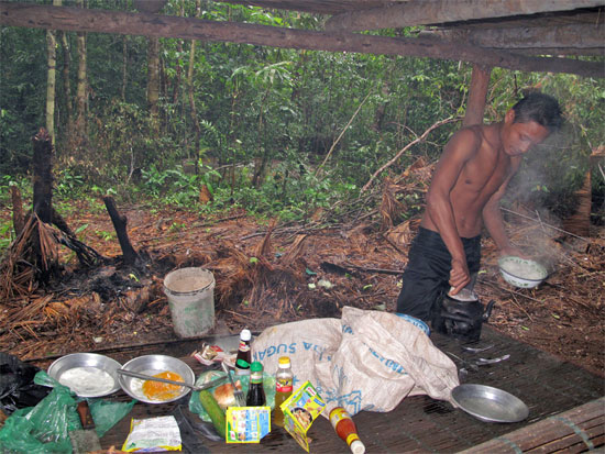 Jungle cook at work. Jungle cook at work.