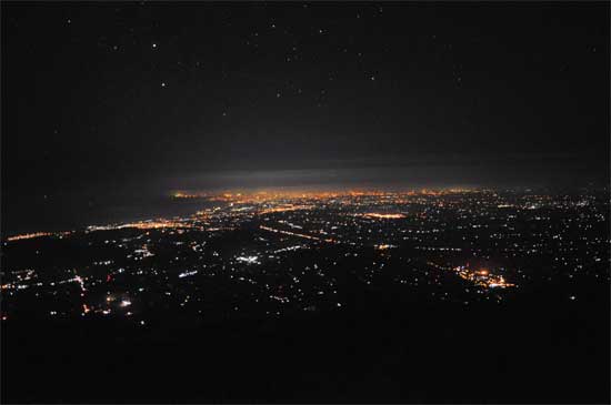 The view from higher up.The distant glow is Kuta, lower right is Besakih temple.
