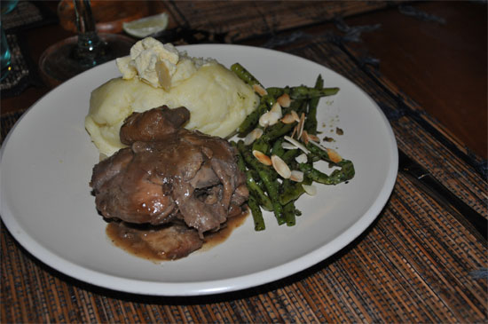 Coq au vin - chicken in red wine sauce, served with mushrooms and bacon, mashed potato, savoury garlic ice cream and green beans with toasted almonds. 88,000 rupiah.