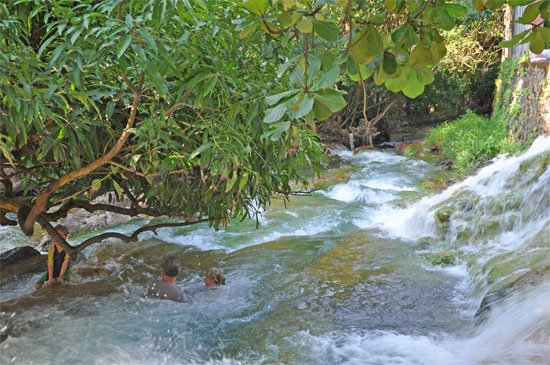 Hot spring + cold waterfall = warm waterslide.