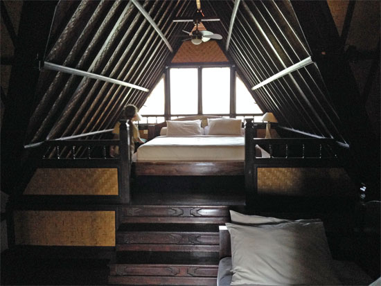 The upper level suite double bed.