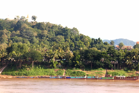 Catch the ferry to the other side of the river and go for a bike ride. Luang Prabang looks different from here.