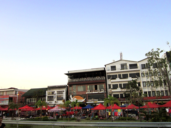 The nightmarket stalls are set up around dusk.