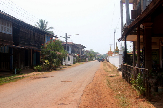 The main street of Champasak is sleepy and charming.