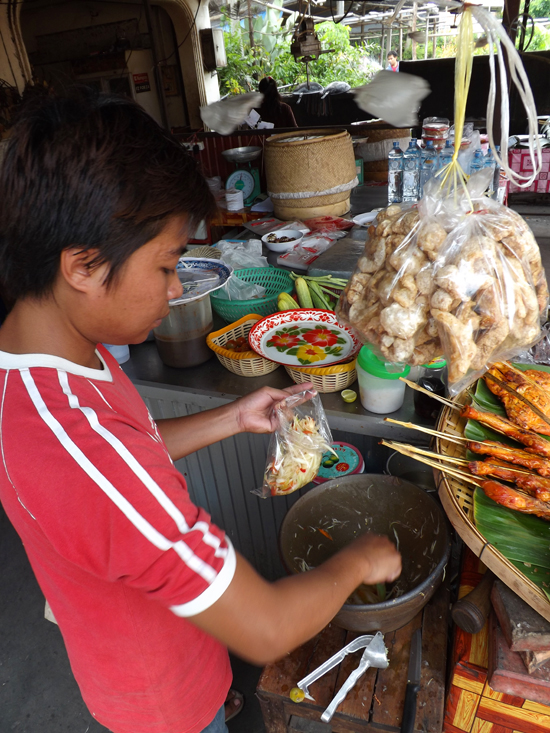 Road-side papaya salad is sold in small plastic bags. Denser than lettuce, a little goes a long way.