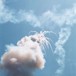 A rocket in Thailand's version of the festival explodes over Yasothon. Obviously the Lao make them better.