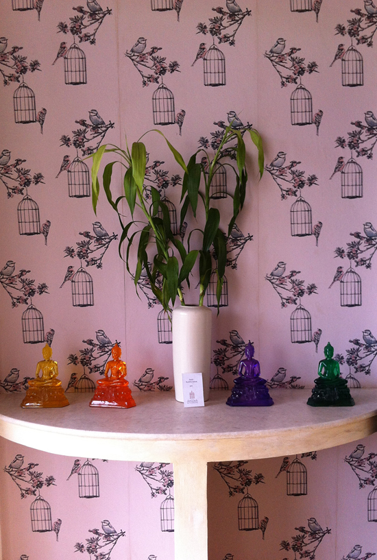 Funky plastic Buddhas and bird cage wallpaper: you either love it or you hate it.