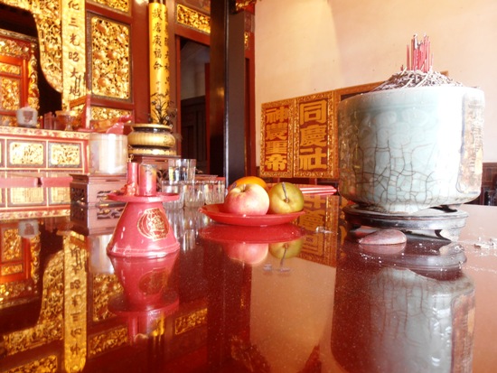 Offerings of fruit and incense to the gods and ancestors.