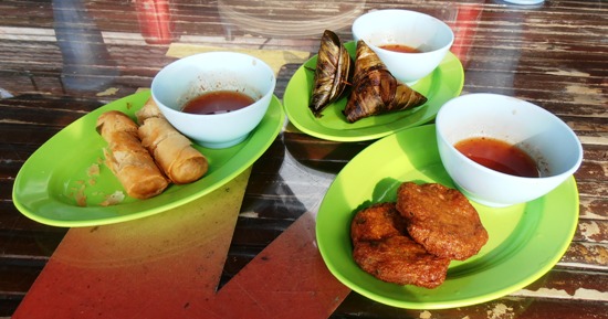 Snacks at the restaurant are cheap and cheerful: spring rolls, pandan chicken and Thai fish cakes.