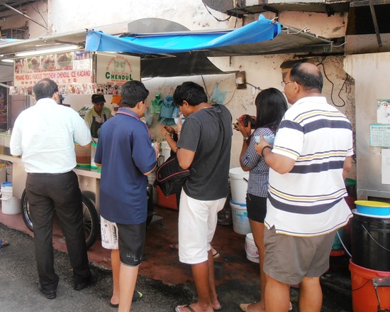 You may have to stand and eat in the alley outside, but a bowl of cendol is a great way to cool down.