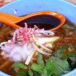 Fiery asam laksa, flavoured with mint, pineapple, chilli and sour tamarind.