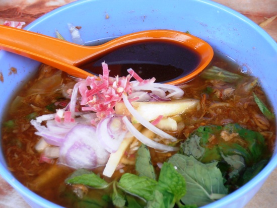 Fiery asam laksa, flavoured with mint, pineapple, chilli and sour tamarind.