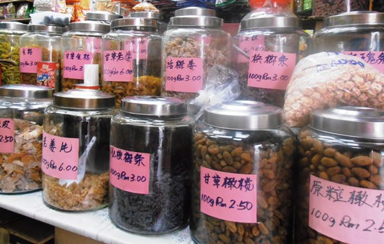 Candied sweet treats, including nutmeg and sour plums.
