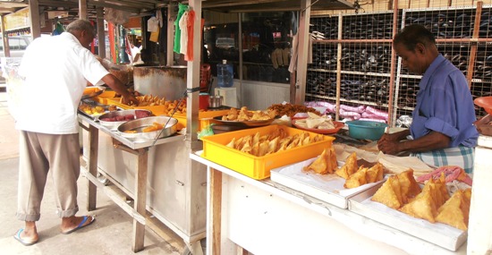 Fill up on delicious snacks at one of Little India's street stalls.