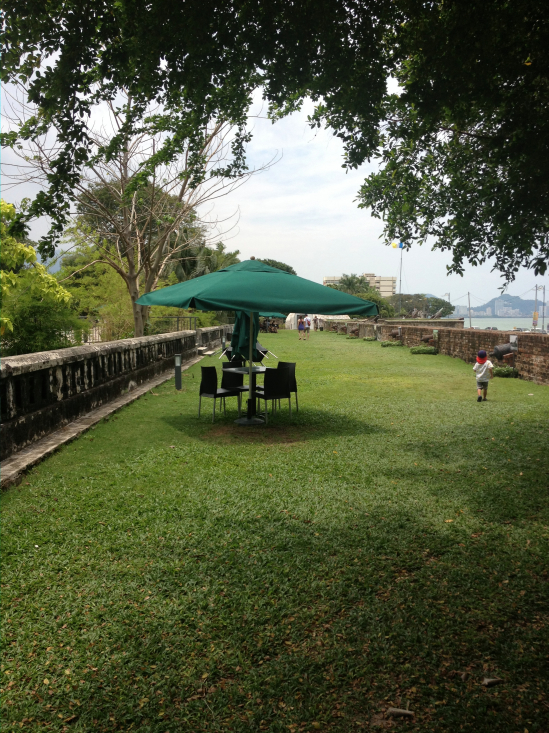 The wide shady ramparts, possibly the breeziest spot for a refreshment in all Penang.
