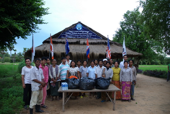 One of the first handovers of clothing from the ABOUTAsia/Hotel de la Paix Share Your Shirt campaign