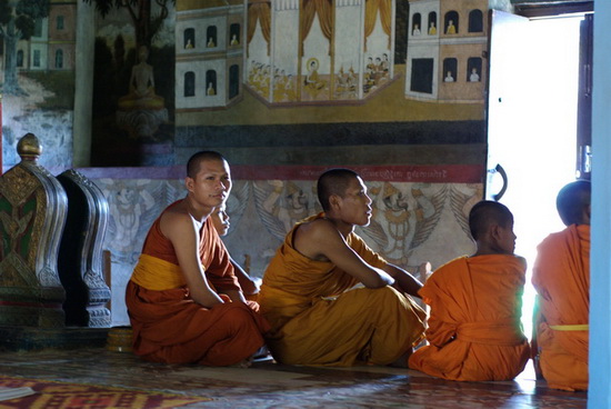 Monks waiting inside Bakong Pagoda, and demonstrating my need for classes