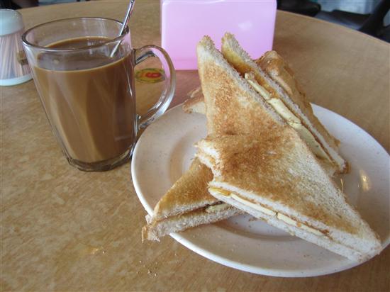 No, that's not a butter sandwich - it's kaya toast and kopi.