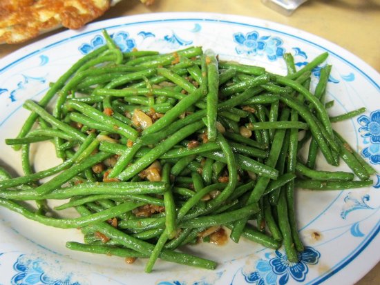 A simple dish of long beans ordered as one of several dishes when dining in a family, to go with rice. Jyou can order any common vegetable at a zi char stall, cooked to the style of your choice.