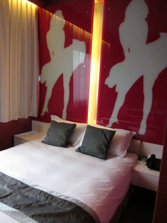 A deluxe room in the Hotel Re! continues with its pink tradition.