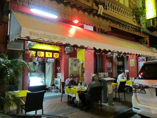 The Café le Caire assumes a lively vibe at night - and you can sometimes find its owner chilling out al fresco.