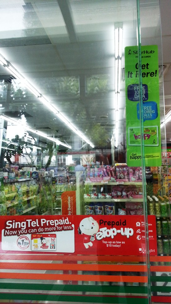 7-Eleven convenience stores sell prepaid mobile SIM cards. This one sells SingTel and StarHub ones.