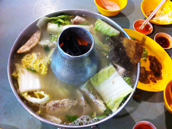 The ingredients are simple: fish-head bits and chunks, vegetables and yams usually accompanied by a chilli dip.