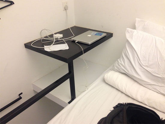 A workspace with a viewing hole onto the couple in the double bed below ...