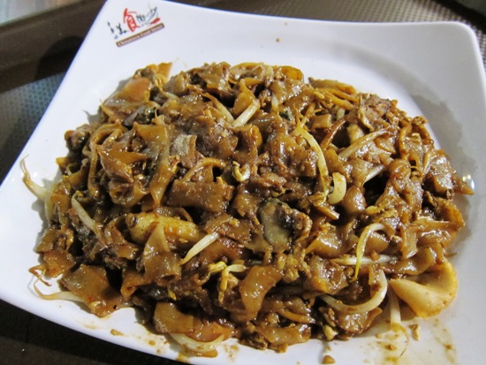 Watch those calories! Char Kway Teow (fried flat noodles) is a filling meal at just $4.