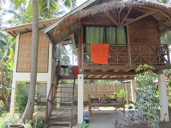 A Standard Bungalow: bathroom on the left, bedroom on the right, terrace below. A Standard Bungalow: bathroom on the left, bedroom on the right, terrace below.