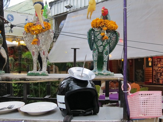 The helmet is first placed before honorific chickens as a show of respect. The helmet is first placed before honorific chickens as a show of respect.