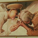 A young King Bhumibol is portrayed comforting one of his subjects.