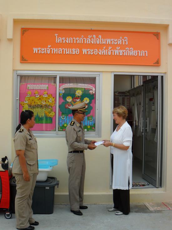 Sisters of Samui (Sue Holehouse) giving monies to previous Director, Khun Arcom Meeryhan Much appreciated. Thank you.