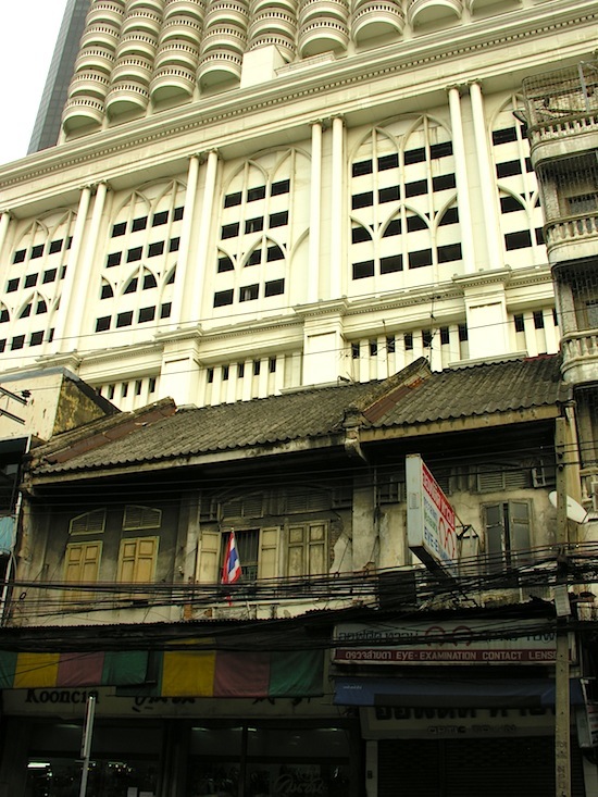 Shophouses under the giant State Tower.