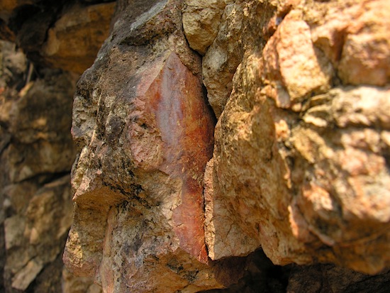 A glimpse of the "hellfire" hidden within the rocks.