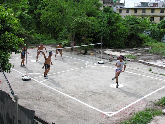 Takraw in an undeveloped Thonburi lot -- the loin cloth sure is intimidating.