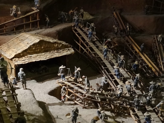 Mini diorama of an open-pit mine.