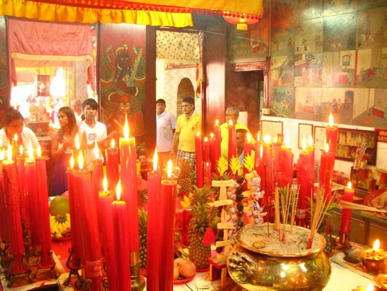 The tiny Por Tor Gong shrine is packed during the festival.