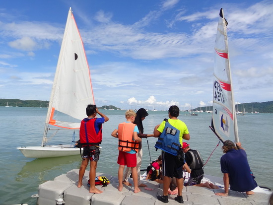 Kids queue up for a free sail session on the club's open day.