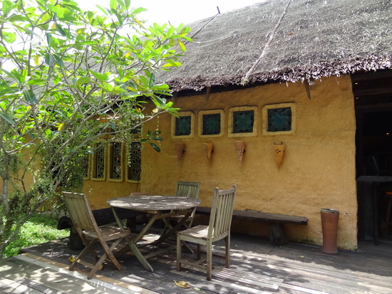 Clay walls and a thatched roof keep things cool inside.