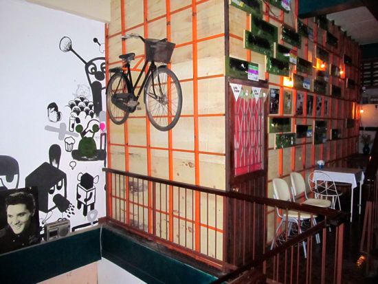 You haven't made it all the way up to the rooftop, and already there's Elvis and a flying bicycle.