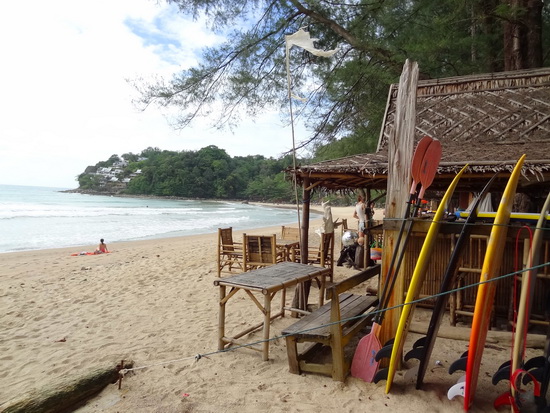 Surf shops and wide sands at Kamala's quieter northern section.