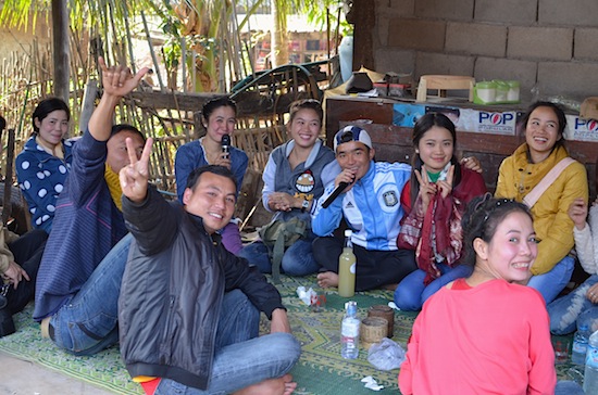 It's easier to sing in Lao after a little rice wine.