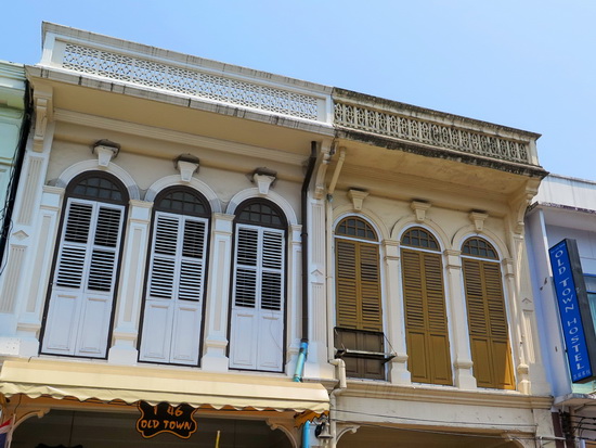 Freshly-painted shutters front the Sino-Portuguese façade.