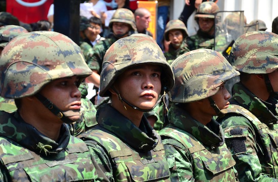 Soldiers mostly stood silent as protests jeered them on Sunday.