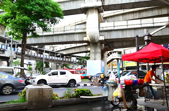 Humble street carts amid a futuristic atmosphere.