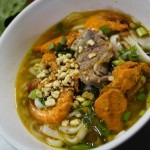 The soup with yellow noodles.